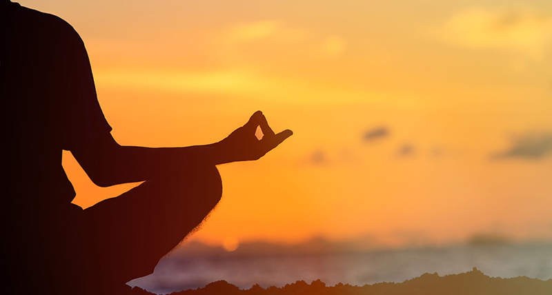 Serenity and yoga practicing at sunset, meditation